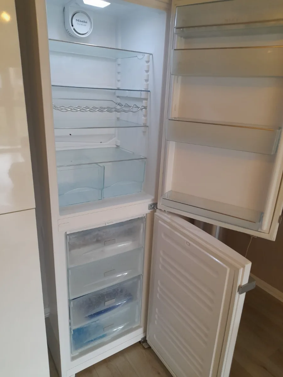 Refrigerator and freezer cleaned inside, shelves and drawers wiped